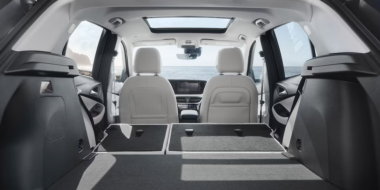 Spacious rear cargo area with folded seats inside the 2026 Buick Encore GX