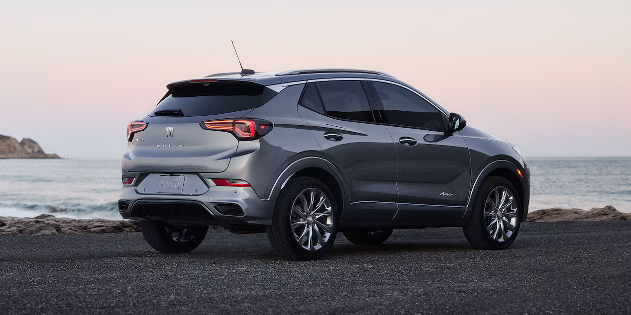Side exterior profile of the 2026 Buick Encore GX parked near lake