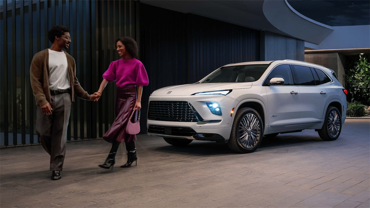Couple walking by 2027 Buick Enclave