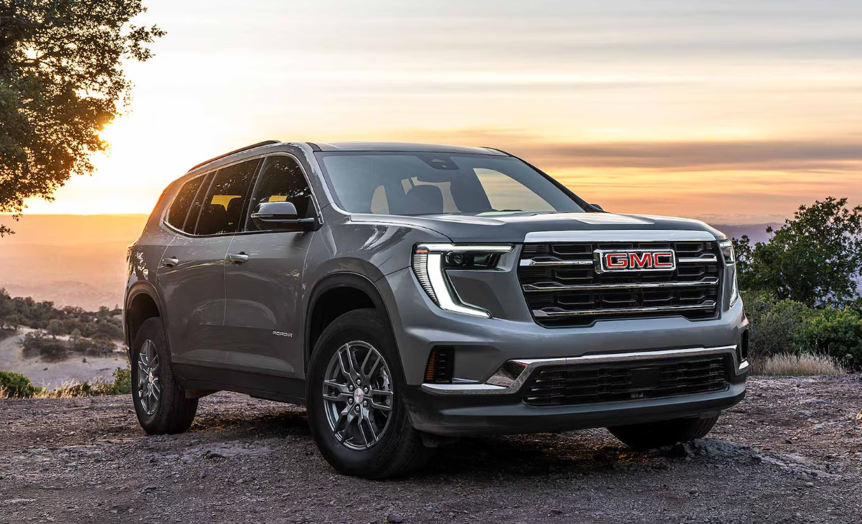 2027 GMC Acadia with the sun setting